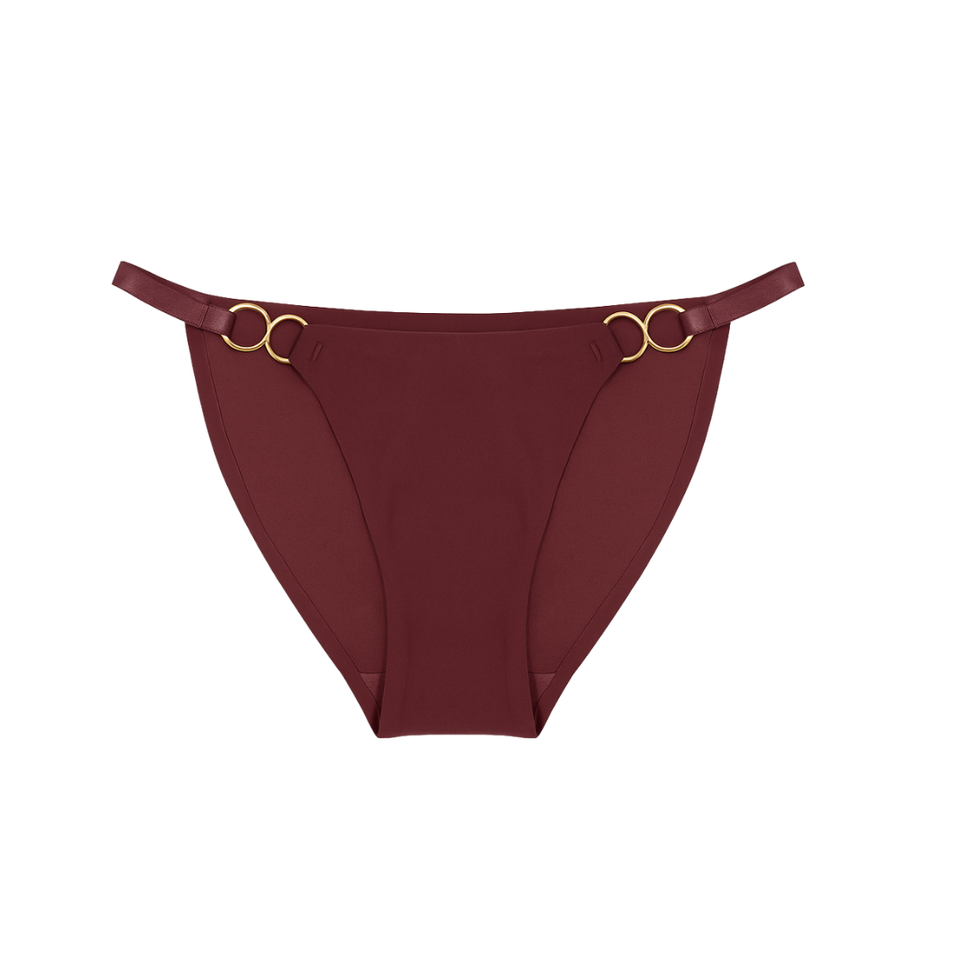 Maroon bikini bottom with gold rings on a white background