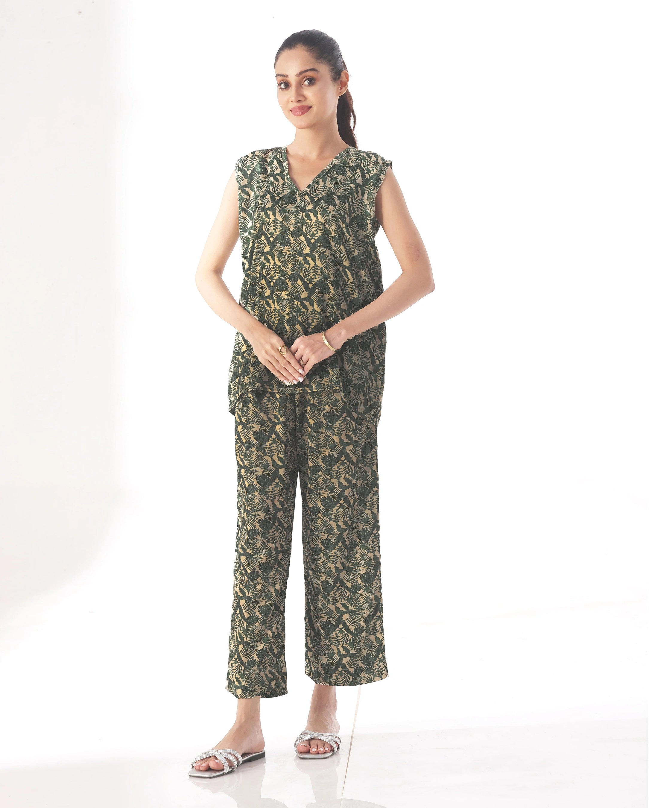 Woman wearing a green camouflage jumpsuit on a white background