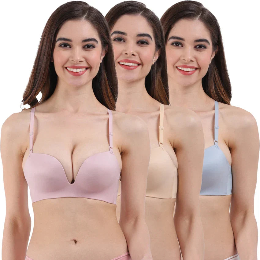 Three women wearing seamless padded bras in Pakistan in pink, nude, and blue colors by Sajiero