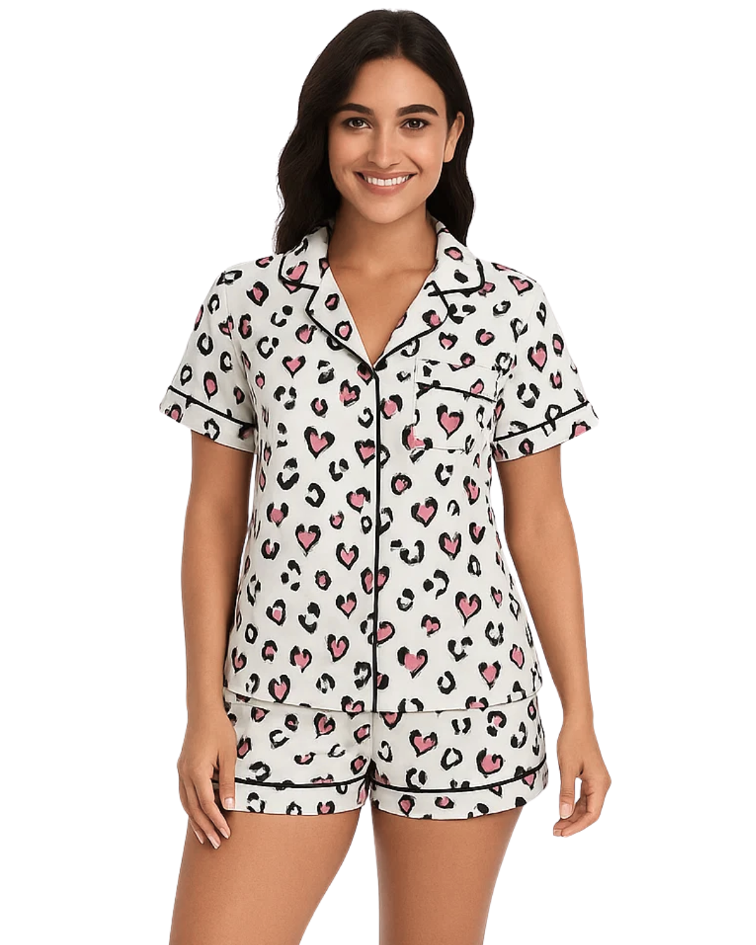 Woman wearing a pajama set with a heart and leopard print pattern on a white background