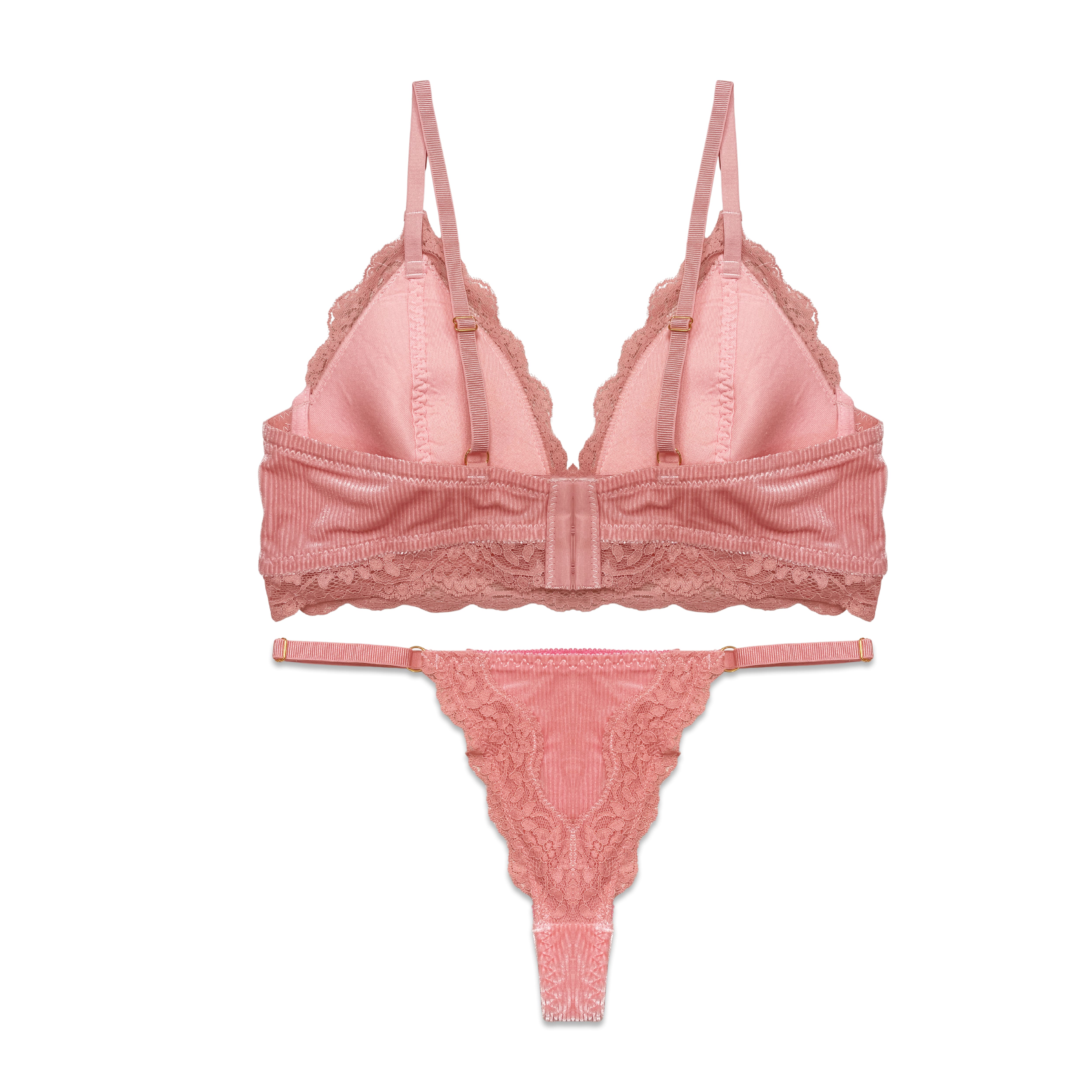 Pink lace lingerie set on a white background