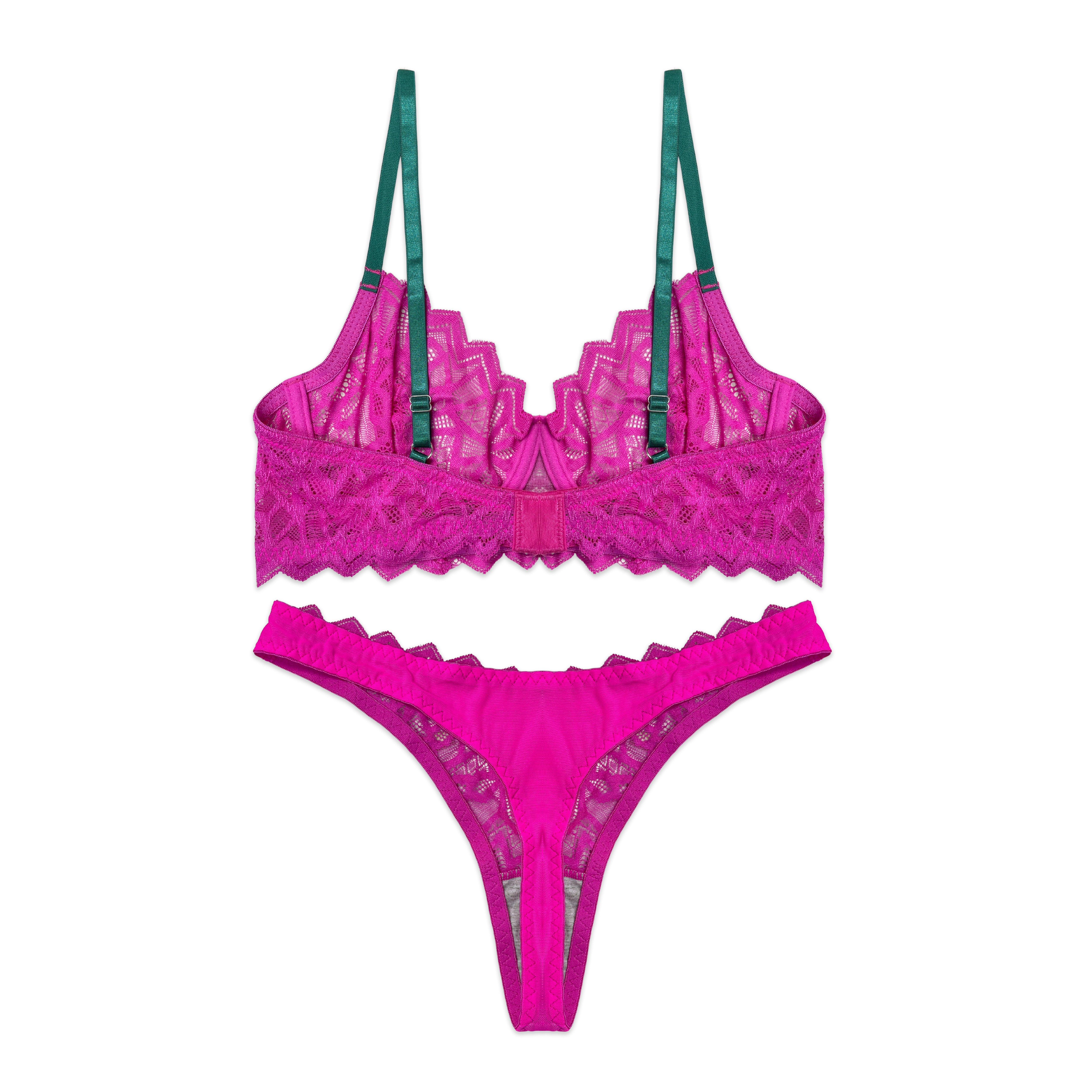 Pink lace lingerie set with green straps on a white background