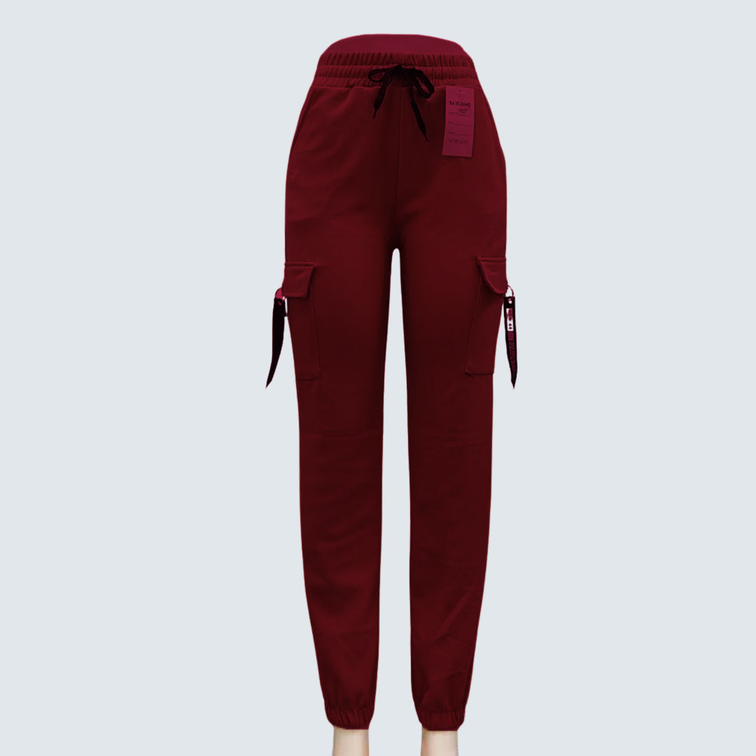 A pair of brown Sajiero trousers made of polyester and spandex, displayed flat on a surface.