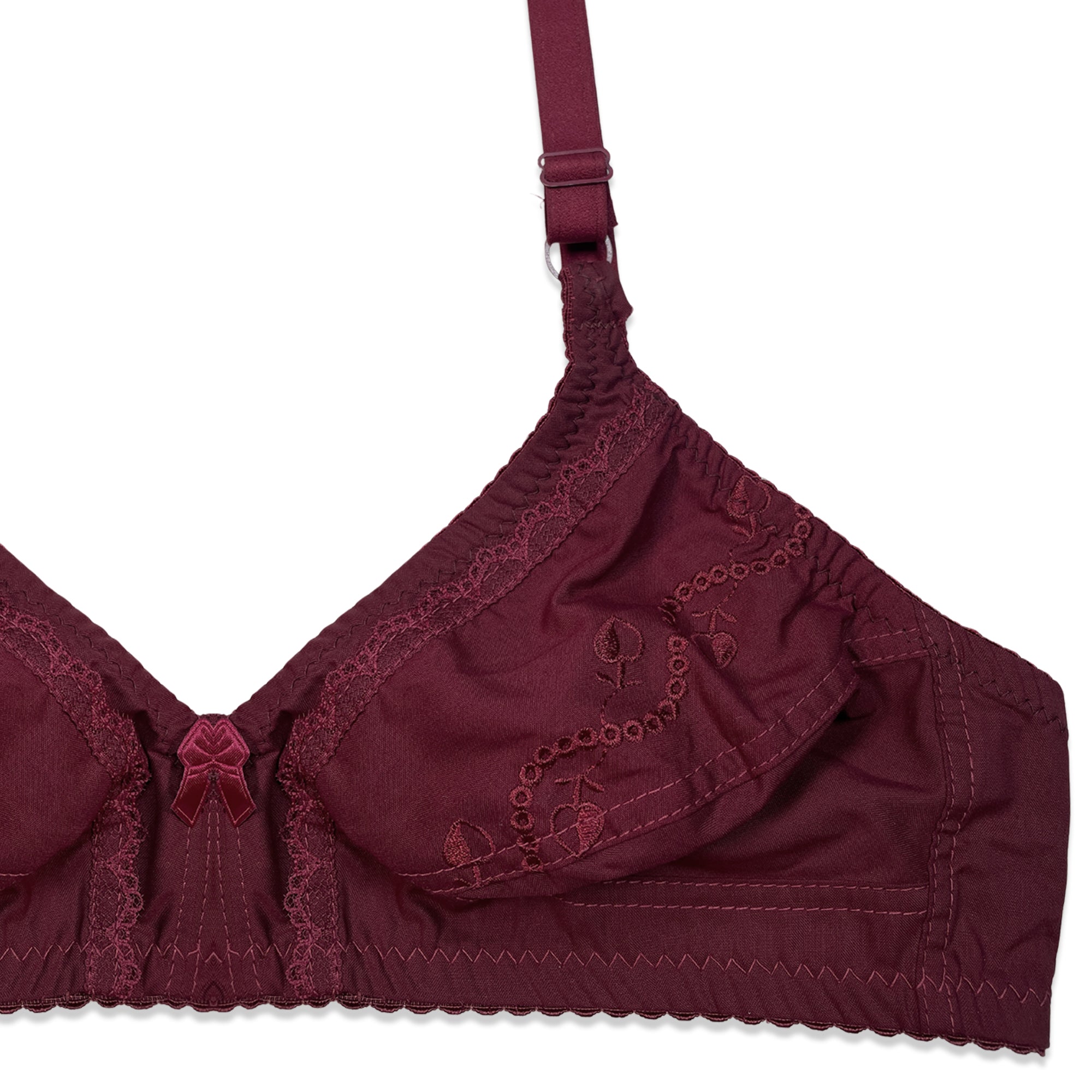 Maroon bra with lace details on a white background